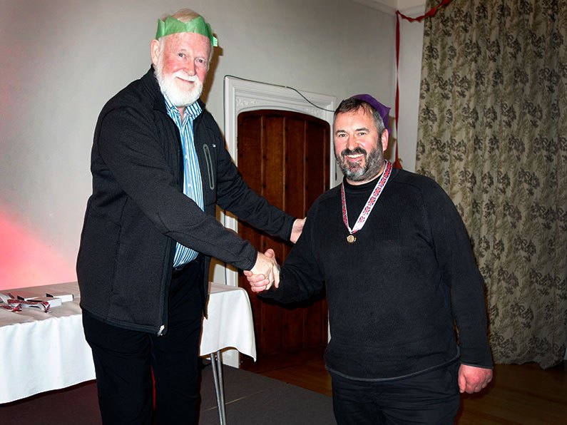 Gerry presenting an Archery award to Courtenay at the Bowmen of Danesfield Christmas Dinner