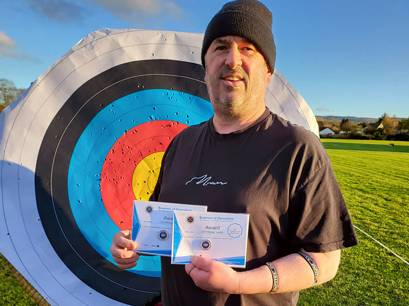 Courtenay Welsh with two Portsmouth 500 certificates Recurve and Barebow