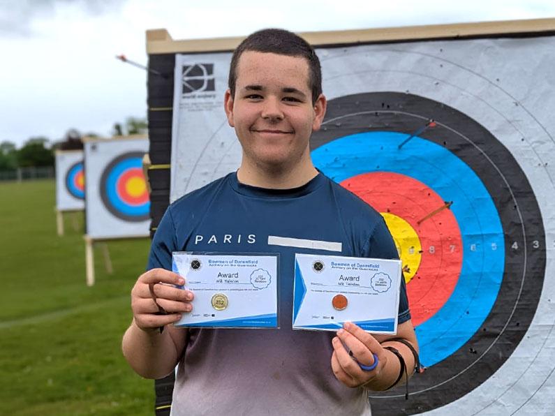 Nik-with-his-252-10and20-archery-awards-001 Nik with his Archery Beginners Course Certificate